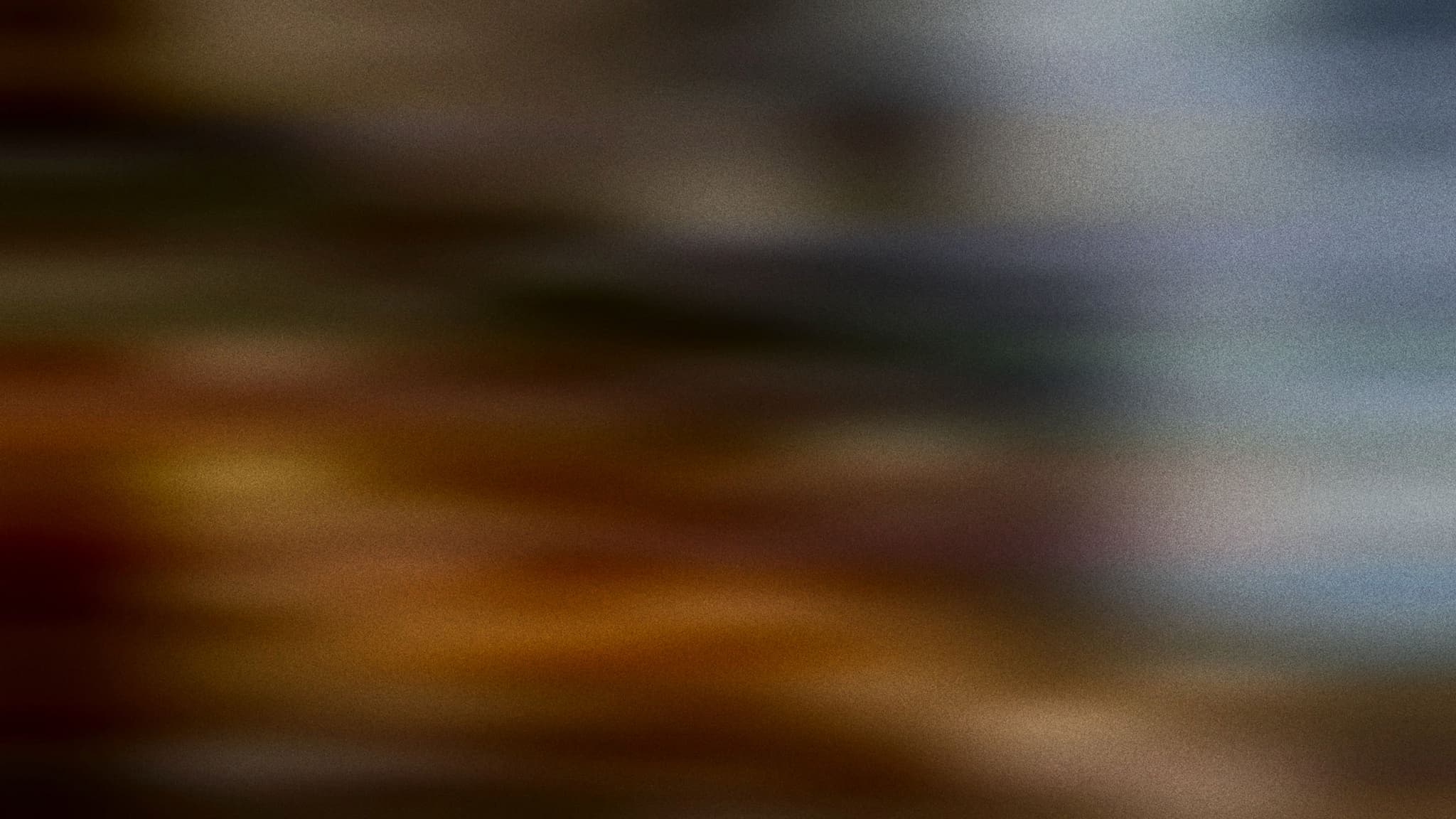 Abstract motion blur in amber and blue grey